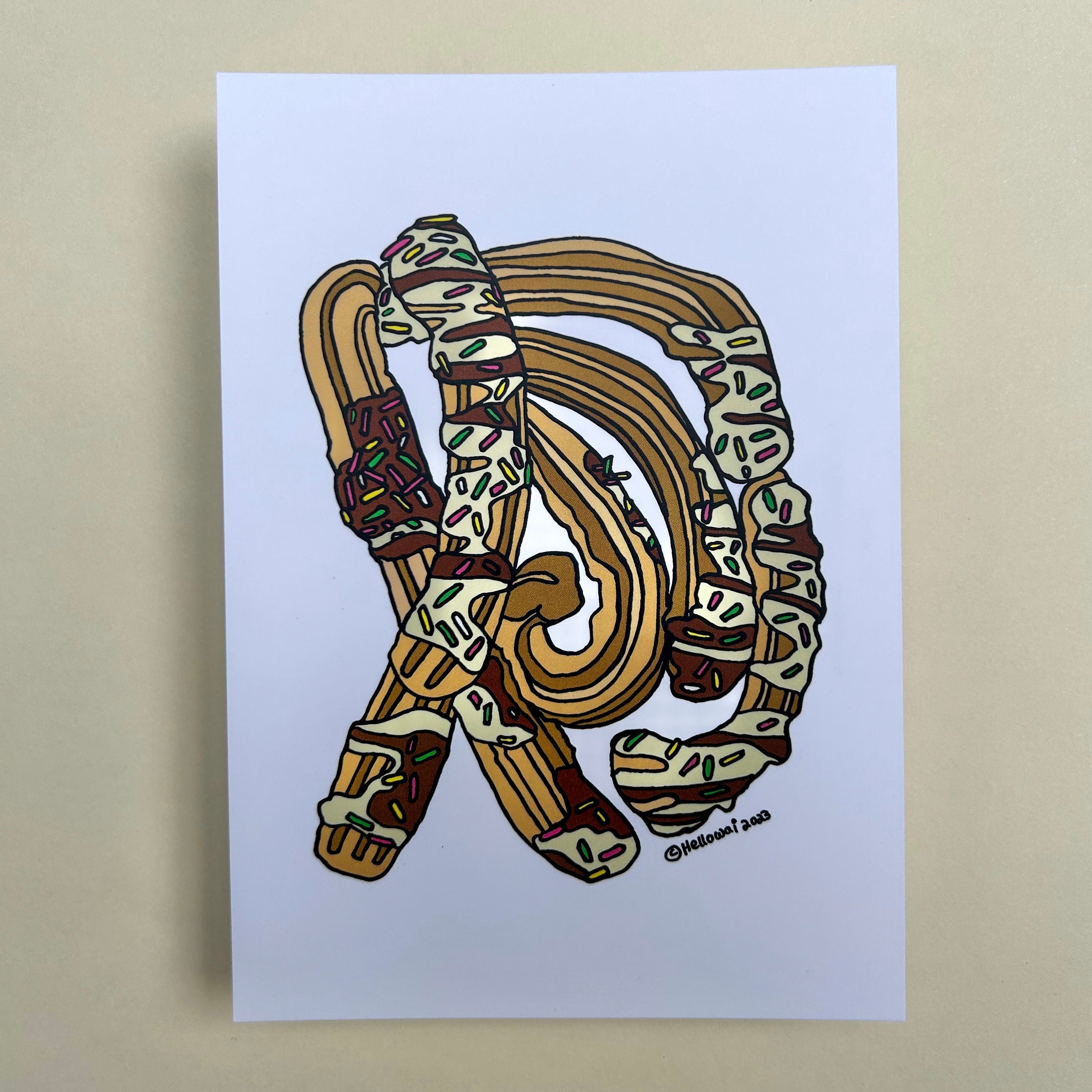 An A6 Hello Wai flat notecard with a colour illustration of Churros with chocolate sauce, rainbow sprinkles printed on white card.