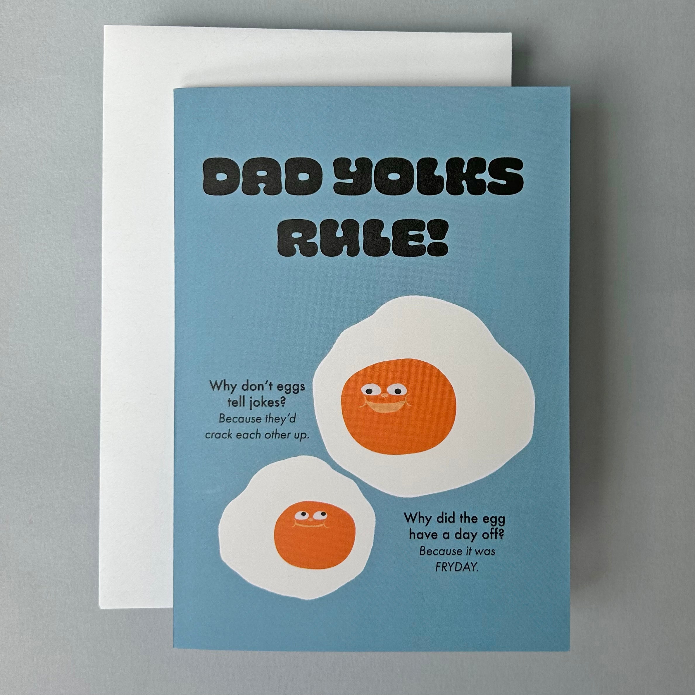 Card with cartoon eggs and humorous text on a blue background