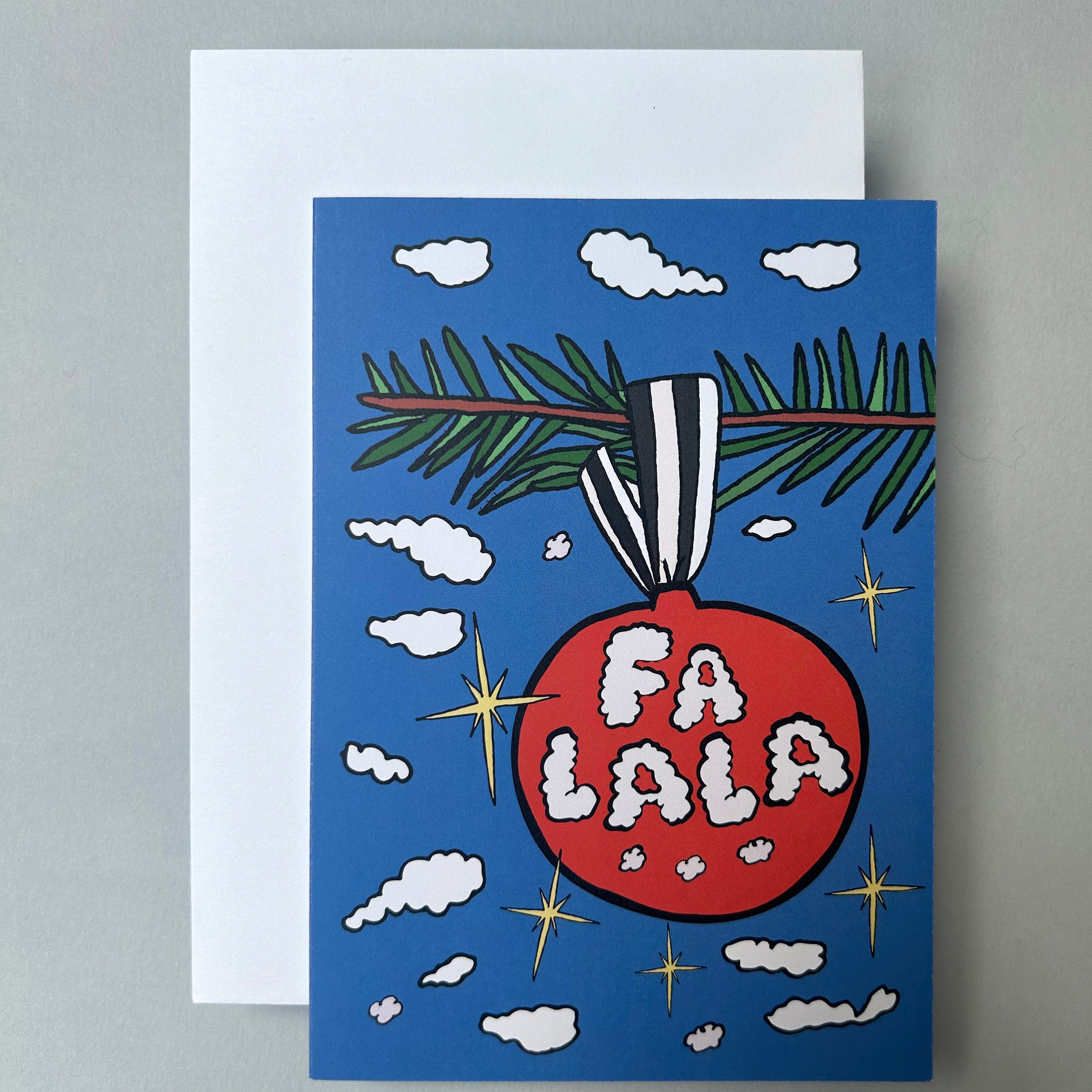 Greeting card with Christmas ornament design and 'FA LA LA' text on a blue background.