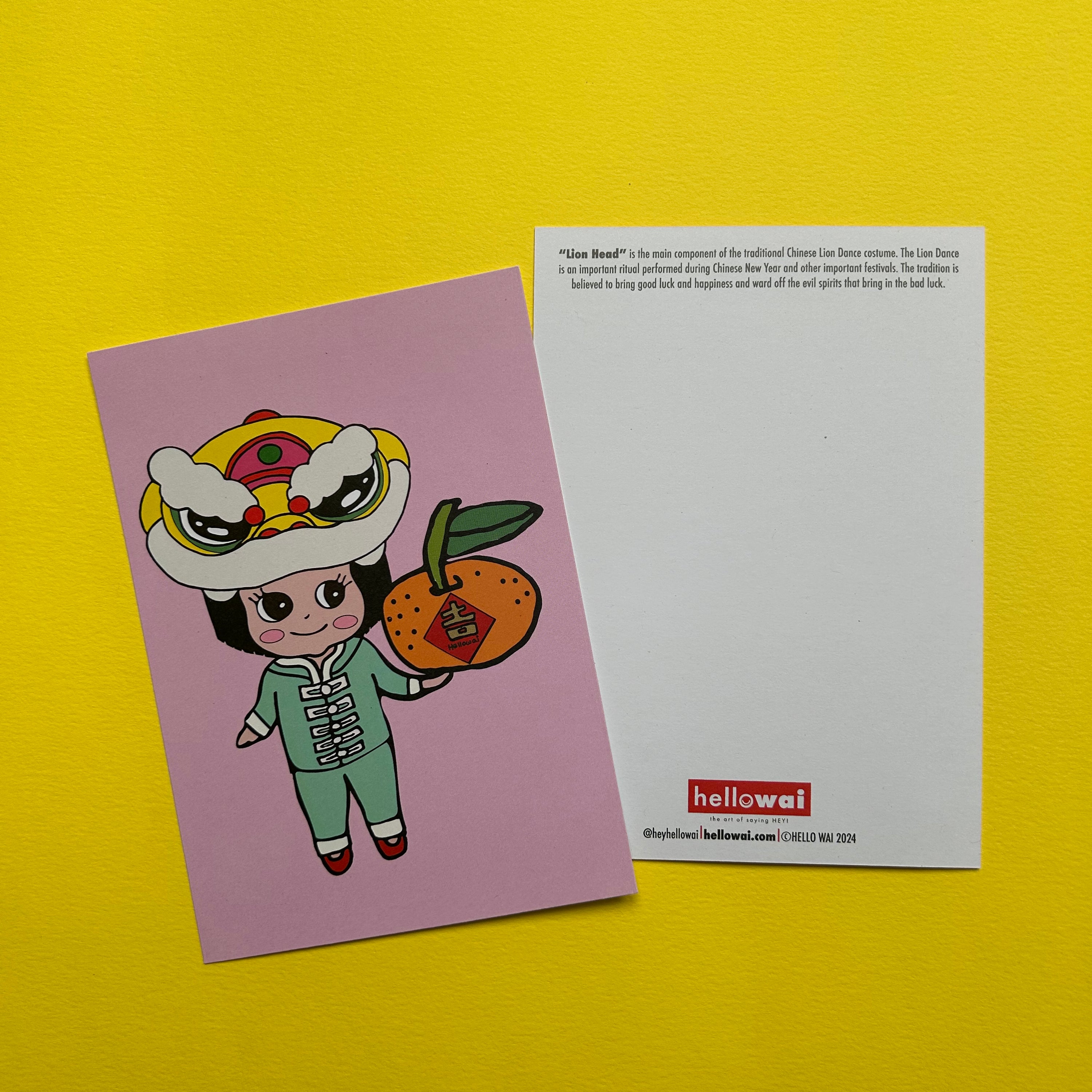 Colour illustration of a girl wearing a Chinese suit, with a Lion Head on her head and holding a large tangerine, printed on a light coloured card next to another card with text and Hello Wai logo at bottom. 