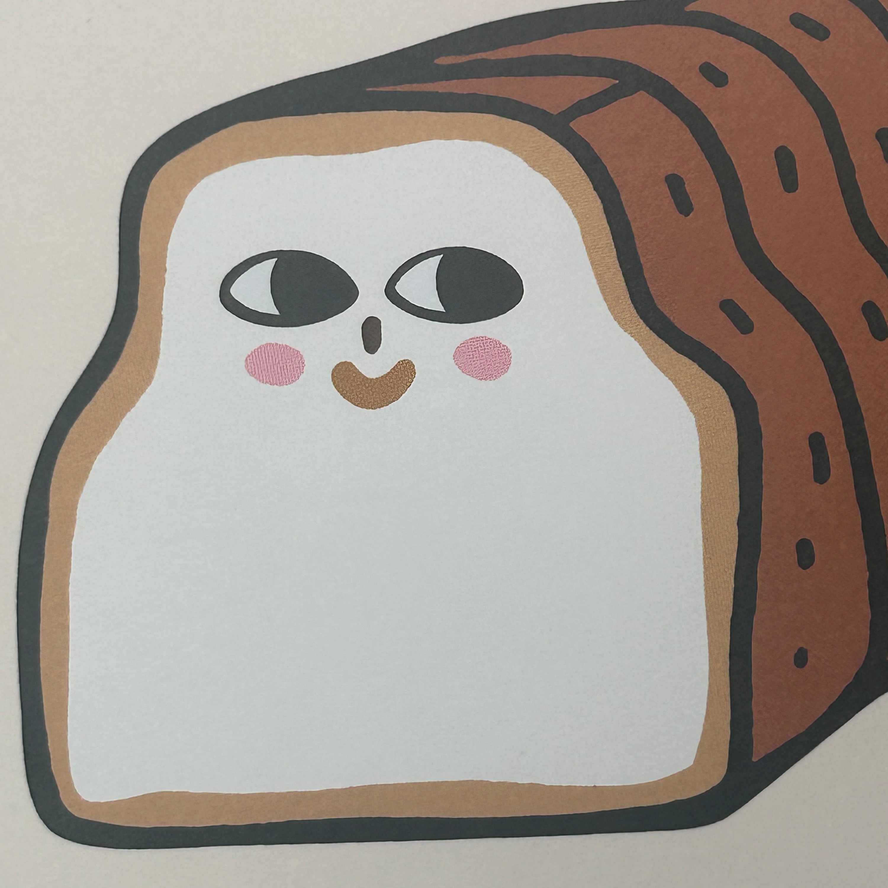 Cartoon face on a slice of bread with a neutral background
