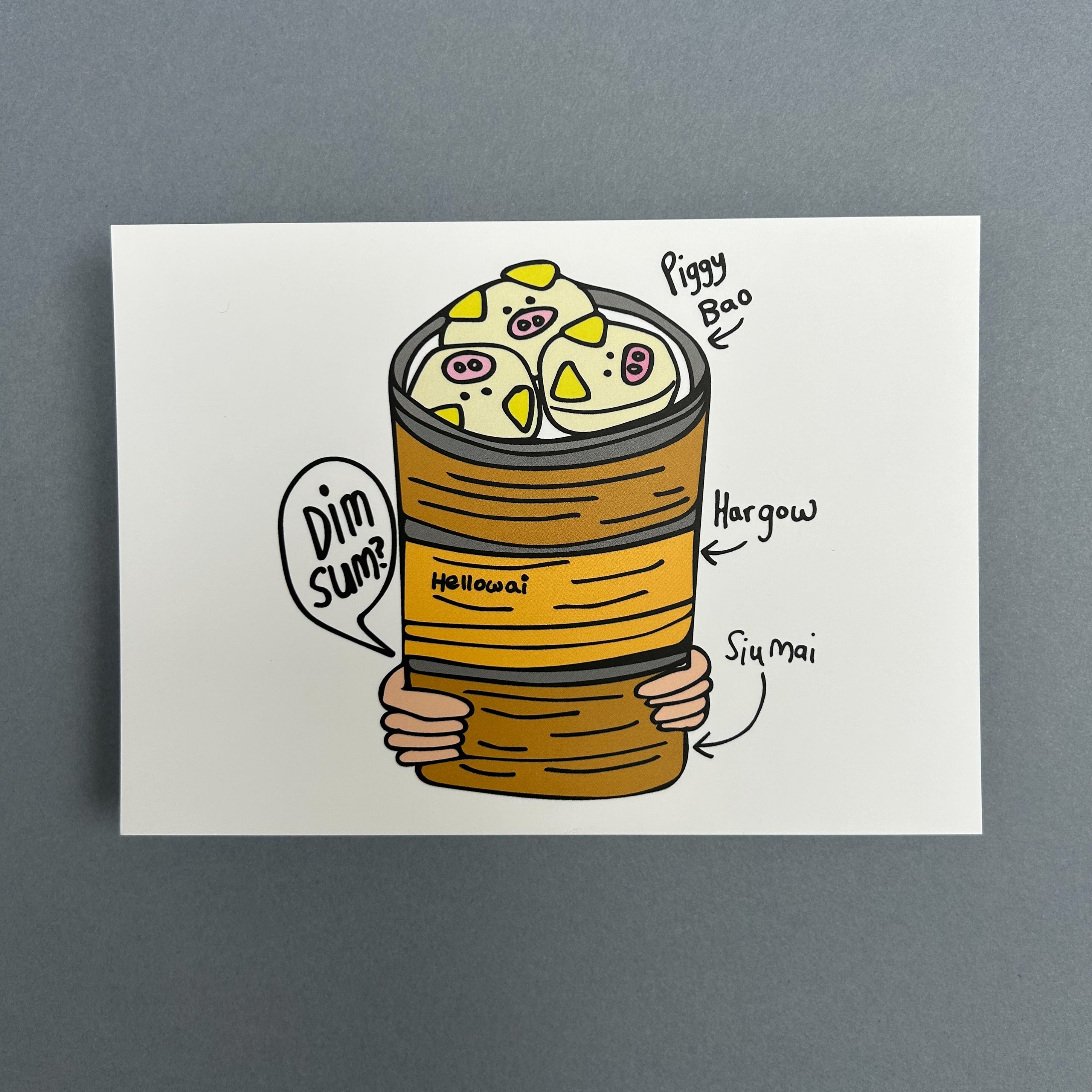 An A6 Hello Wai flat notecard with a colour illustration of pair of hands carrying three bamboo baskets stacked with dim sum, the top basket has piggy bao, printed on white card.