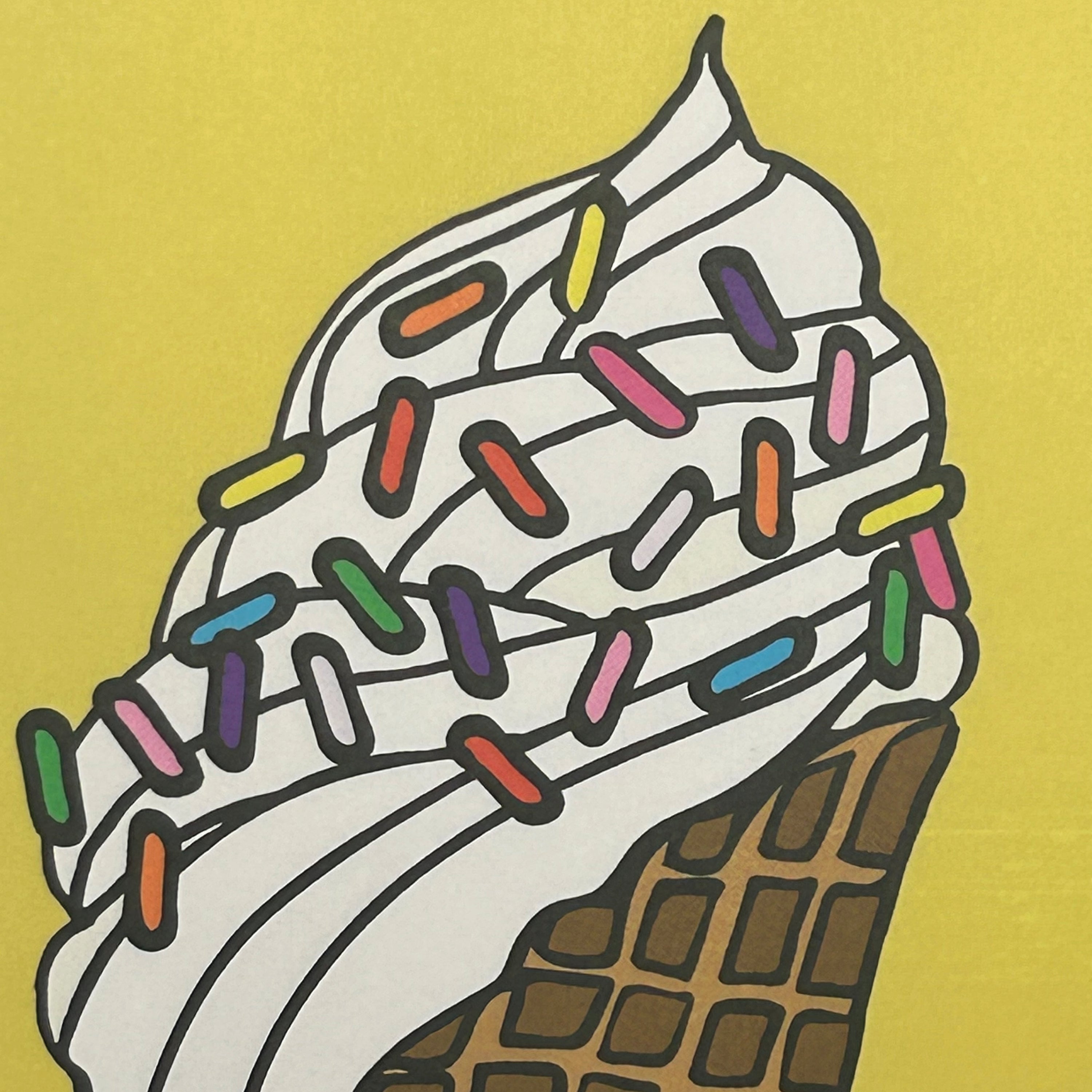Colorful ice cream cone with white frosting and multicolored sprinkles on a yellow background