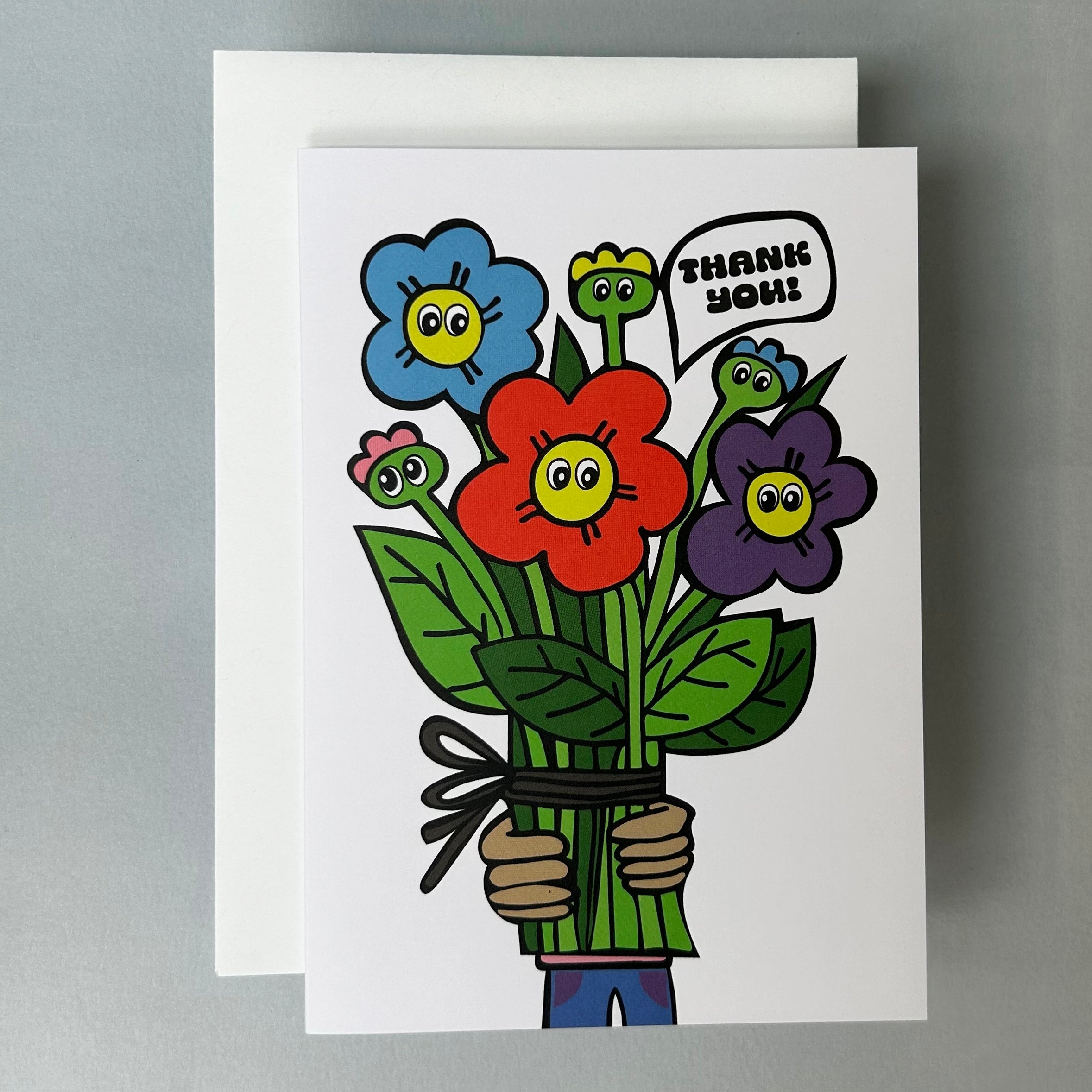 Cartoon-style illustrated card with flowers and a speech bubble saying 'Thank you!' with a white envelope against a light grey background.