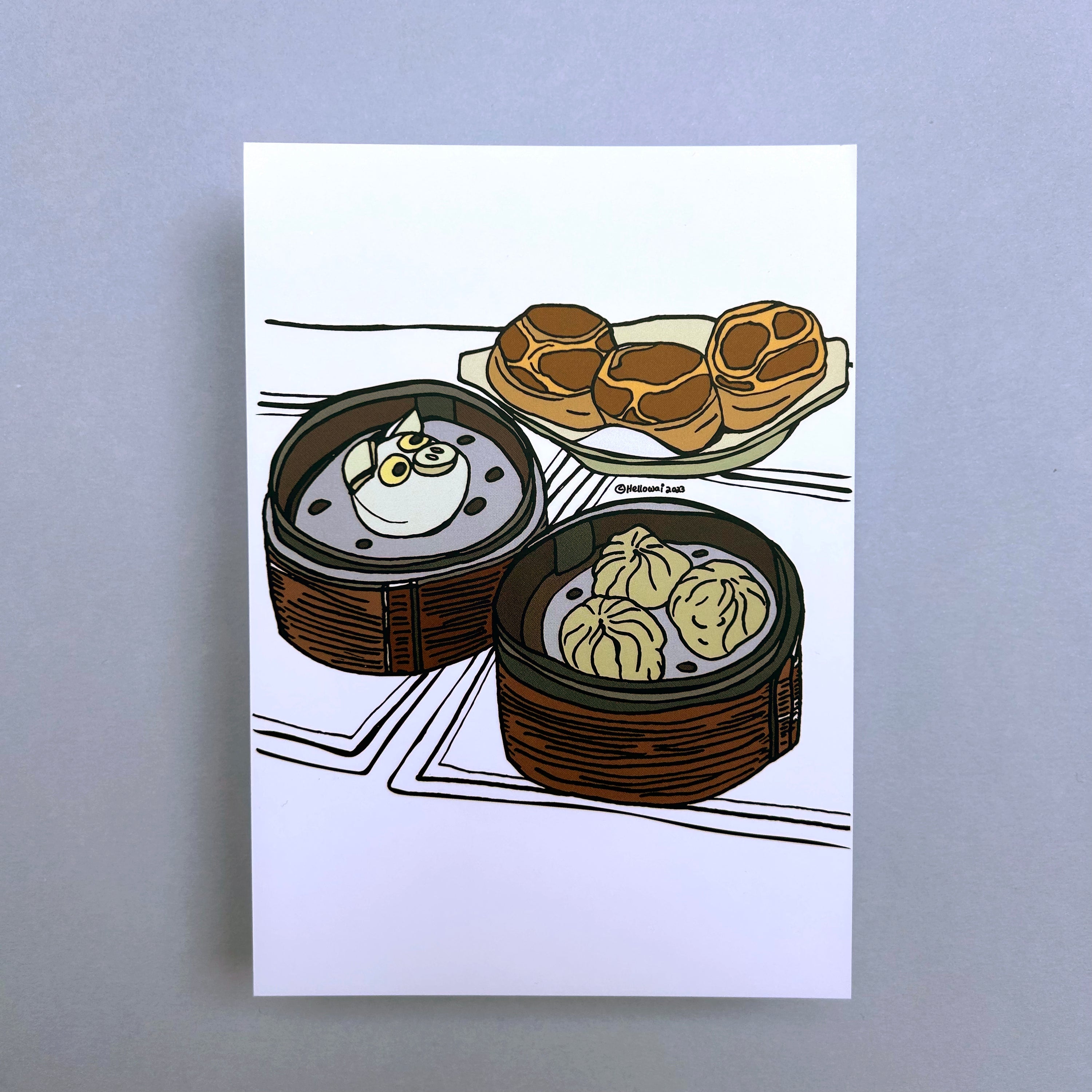 An A6 Hello Wai flat notecard with a colour illustration of two bamboo baskets of Chinese bao, and a plate of bolo bao, printed on white card. 