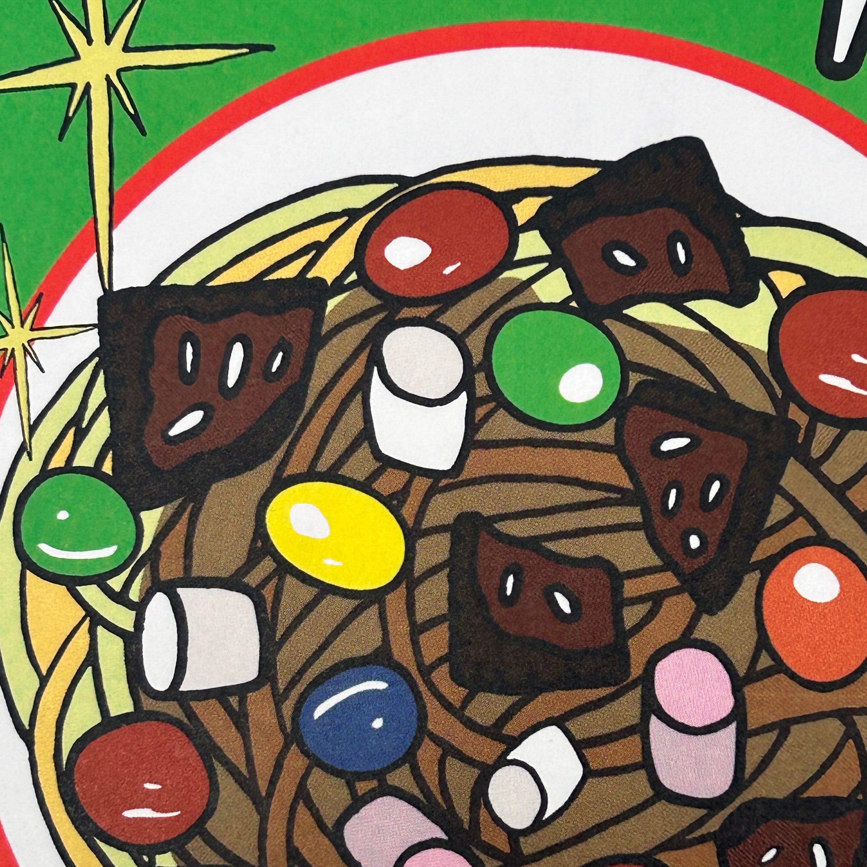 Colorful candy arrangement with various shapes and colors on a green background